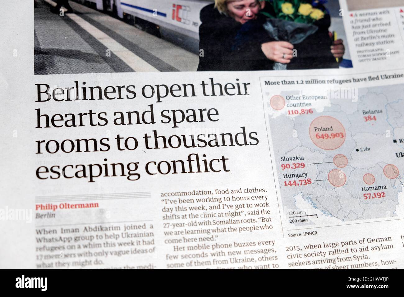 'Berliners open their hearts and spare rooms to thousands escaping conflict'  Ukraine refugees in Berlin Guardian newspaper headline 5 March 2022 UK Stock Photo