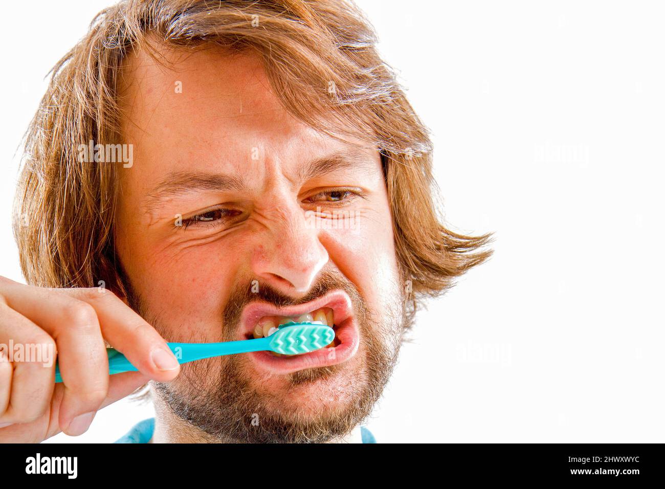 The picture shows a man brushing his teeth Stock Photo Alamy