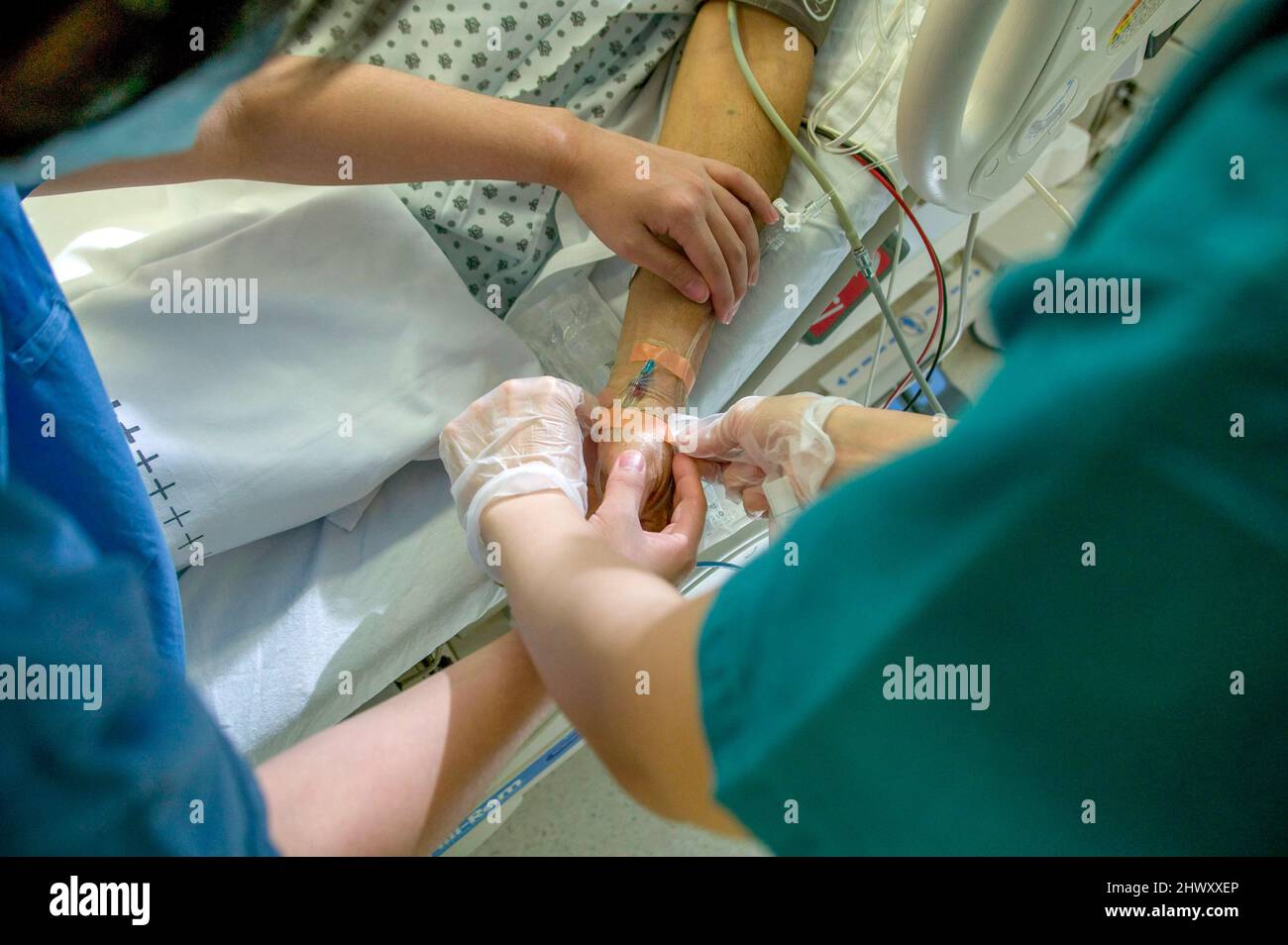 A patient has an intravenous drip inserted into the arm Stock Photo - Alamy
