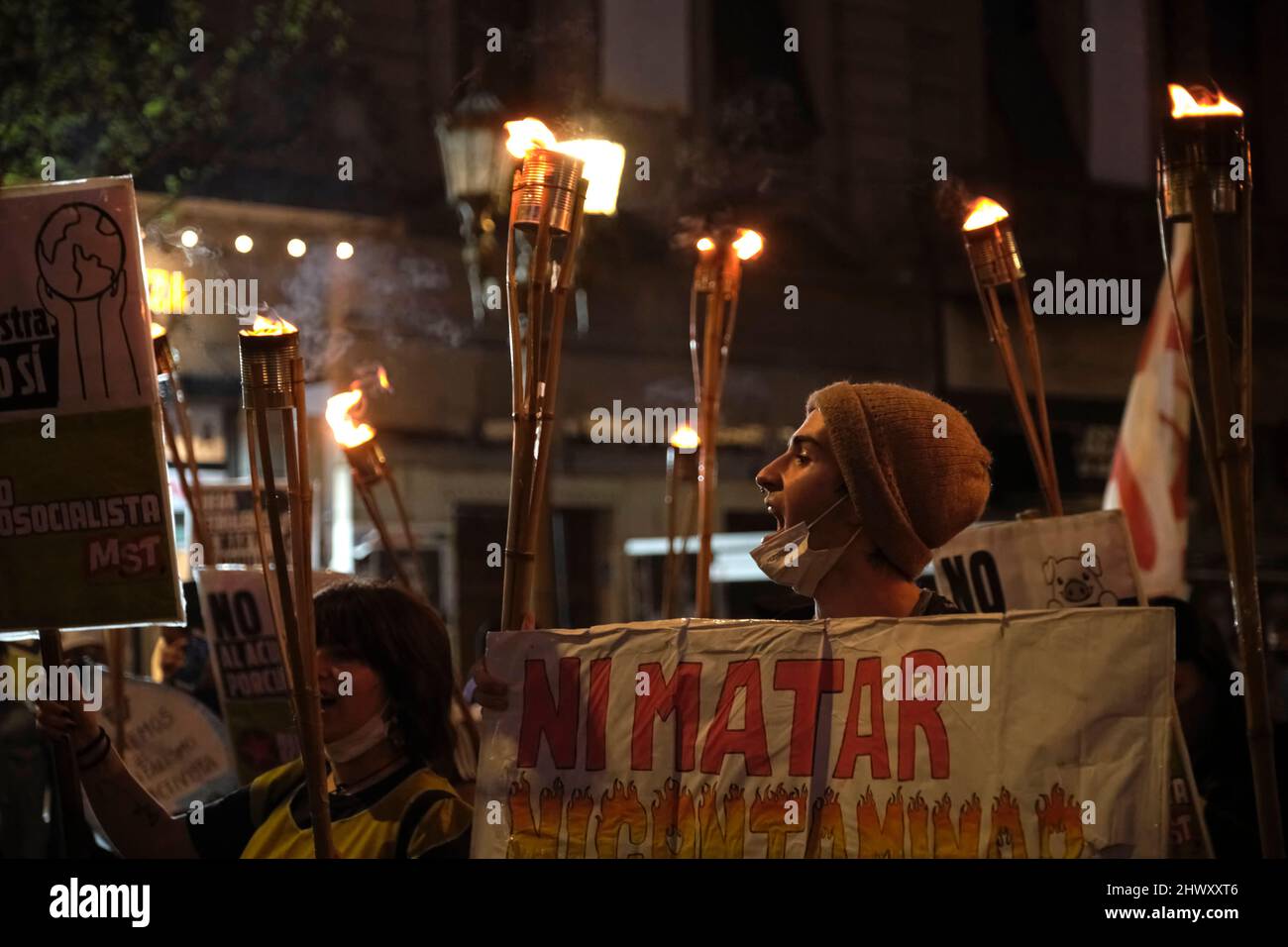CABA, Buenos Aires, Argentina; Sept 24, 2021: young people protesting with torches in front of the National Congress during the Global Climate Strike. Stock Photo