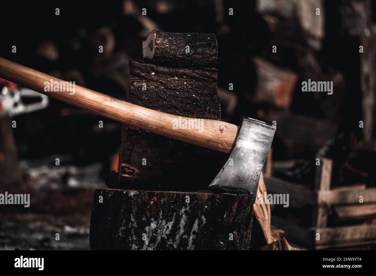 Axe in the log. Ax stuck in a tree stump Stock Photo