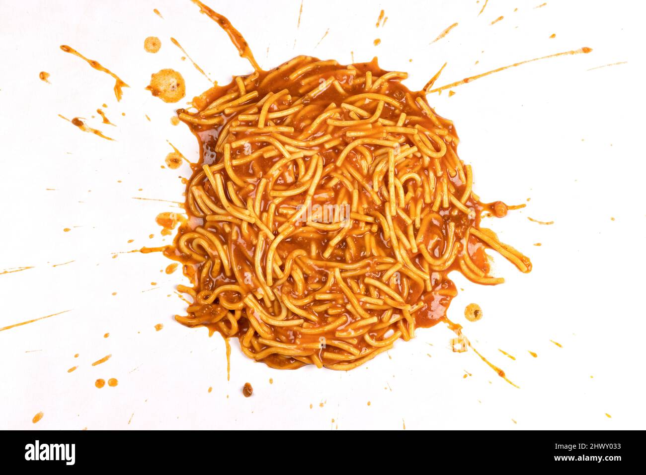 Spaghetti Bolognese splattered on a white background. Stock Photo