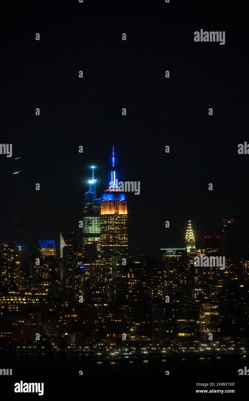 New York City skyline in blue and yellow lights, in solidarity with ...