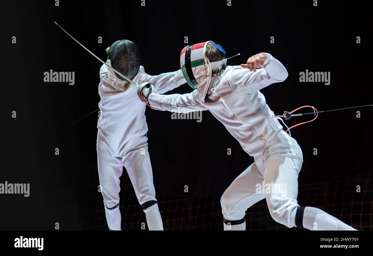Fencer with fencing sword. Fencers duel concept Stock Photo Alamy