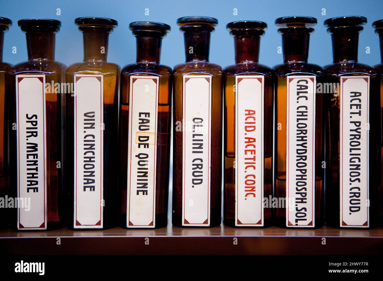 Absinthe related bottles in a display case in the Maison de l'Absinthe in Môtiers, Switzerland. Stock Photo