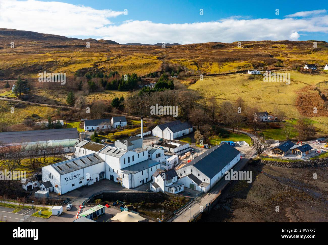 Aerial view from drone of Talisker distillery in Carbost on the Isle of Skye, Scotland, UK Stock Photo