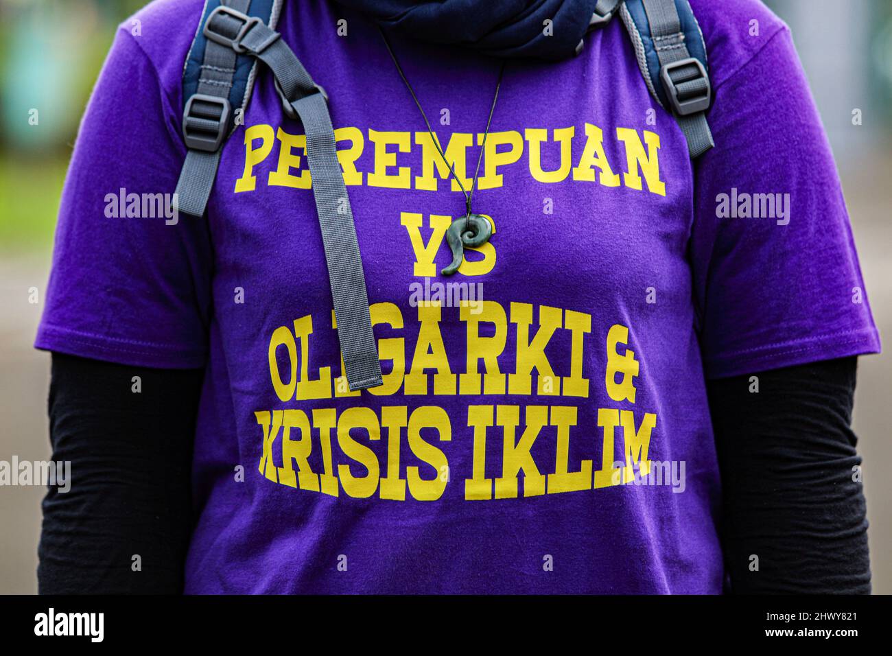 Jakarta, Indonesia. 08th Mar, 2022. An activist wears a t-shirt that reads 'Women vs Oligarchy' during the protest on International Women's Day.Women activists rally on International Women's Day in the Monas area, Jakarta. The mass demand the government to implement a social protection system that does not discriminate against women. (Photo by Aslam Iqbal/SOPA Images/Sipa USA) Credit: Sipa USA/Alamy Live News Stock Photo