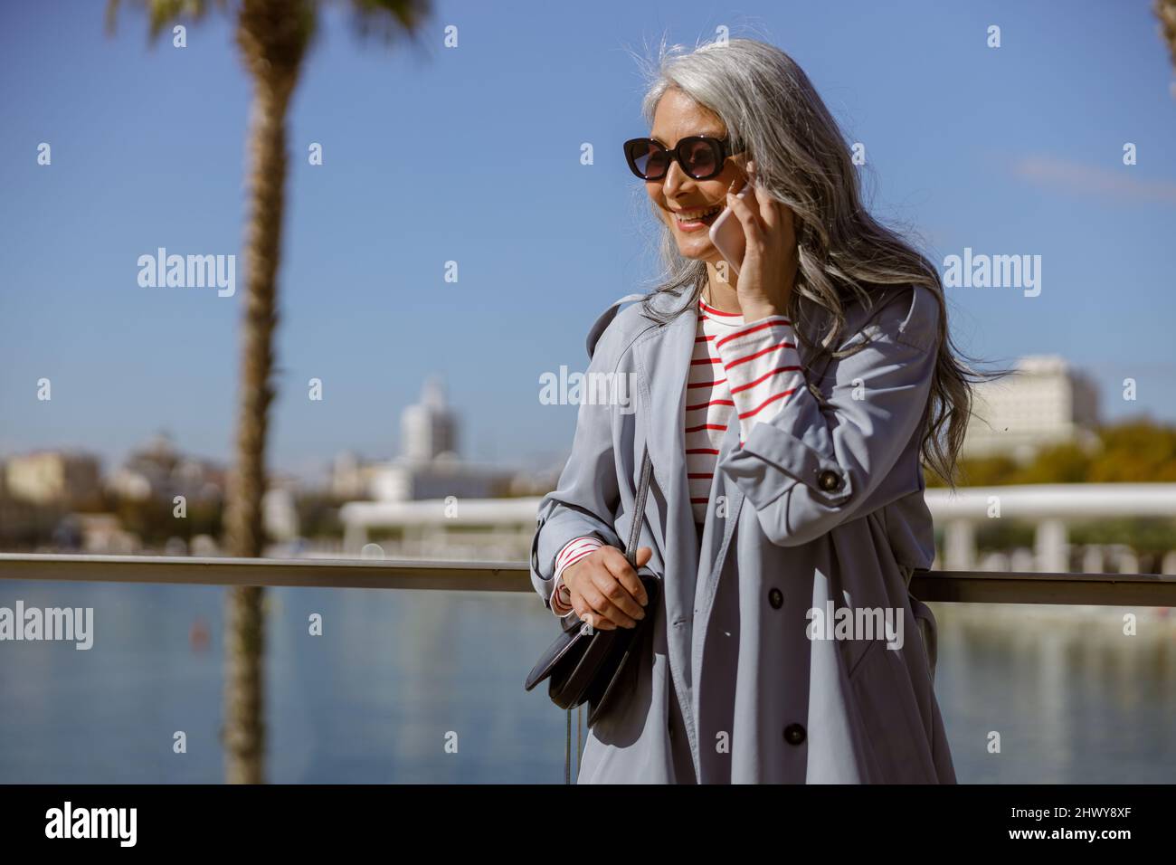 Lady and smartphone and outdoors hi-res stock photography and images ...