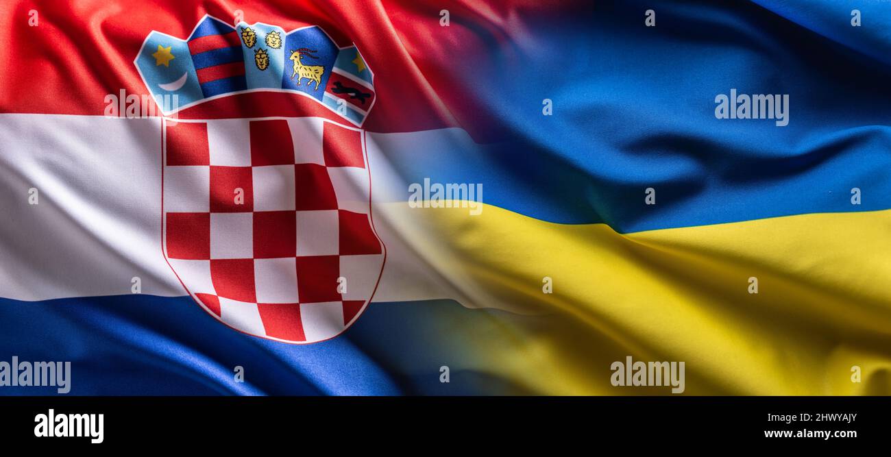 Waving flag concept of Ukraine and Croatia symbolising political connection. Stock Photo