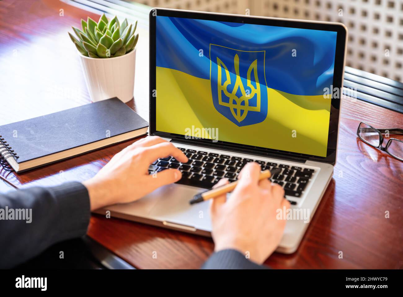 Support Ukraine, donate help Ukrainian people. flag on computer laptop