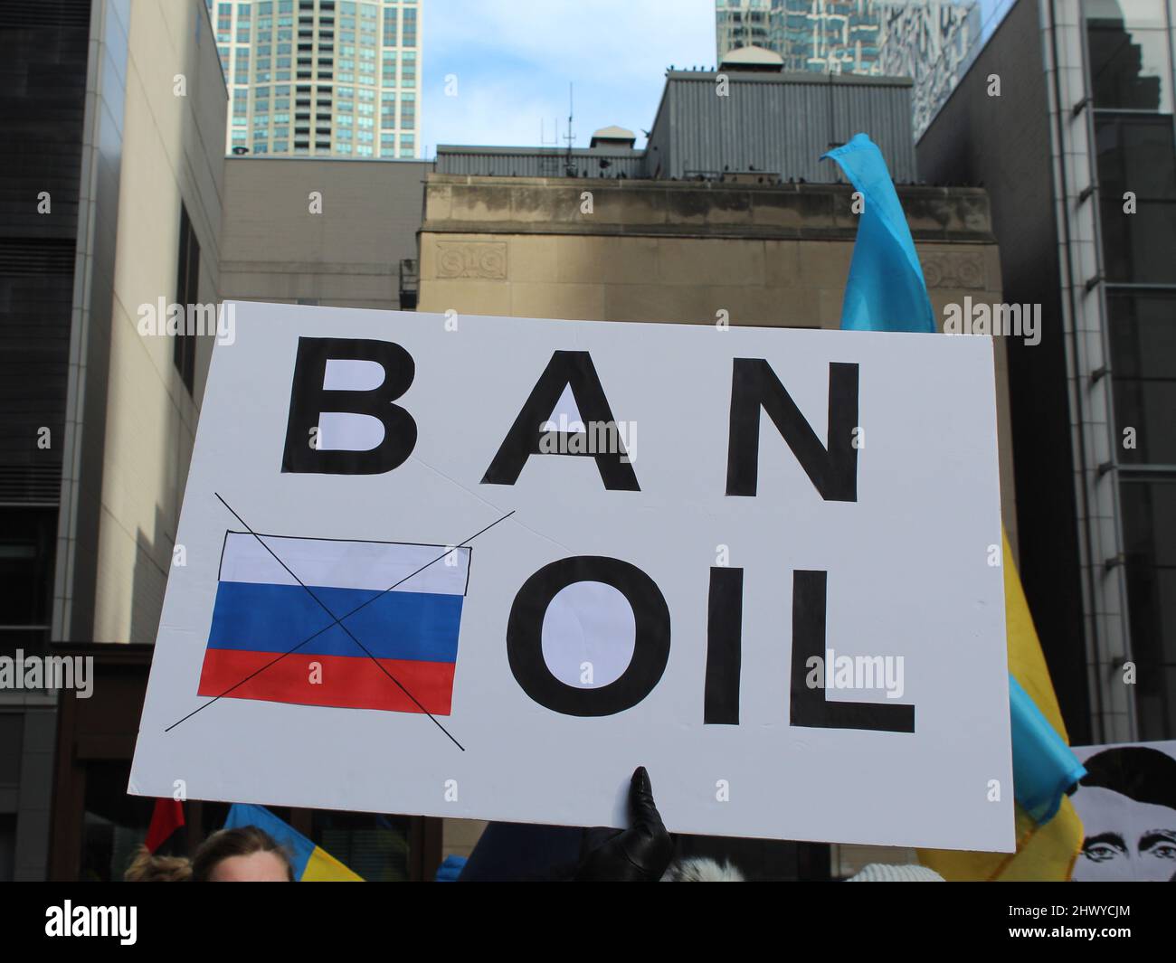 Ban Russian Oil protest sign with Russian flag at Daley Plaza in Chicago Stock Photo