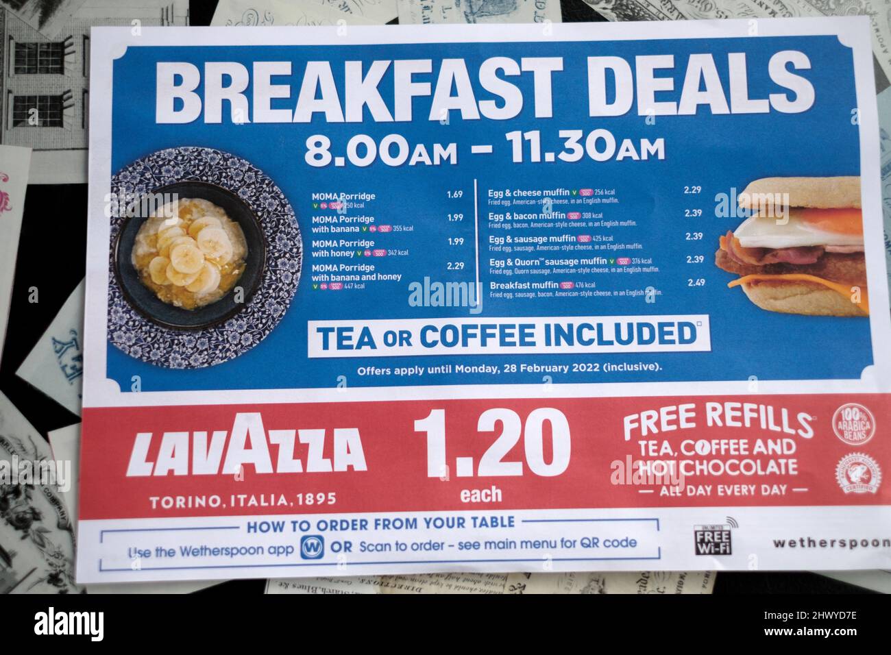 A menu card from a JD Wetherspoons pub. The card shows the prices of the popular breakfast options available in the pub every morning Stock Photo