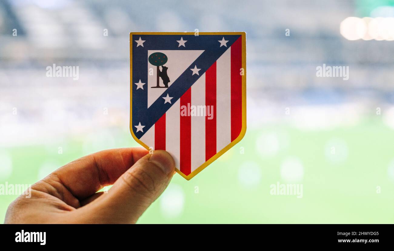 September 12, 2021, Madrid, Spain. The emblem of the football club Atletico Madrid against the background of a modern stadium. Stock Photo