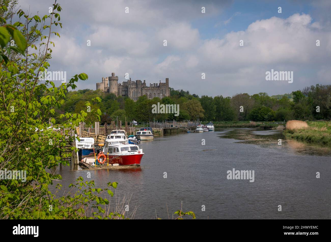 Boats on the River Arun with Arundel Castle in the background, West Sussex, UK Stock Photo