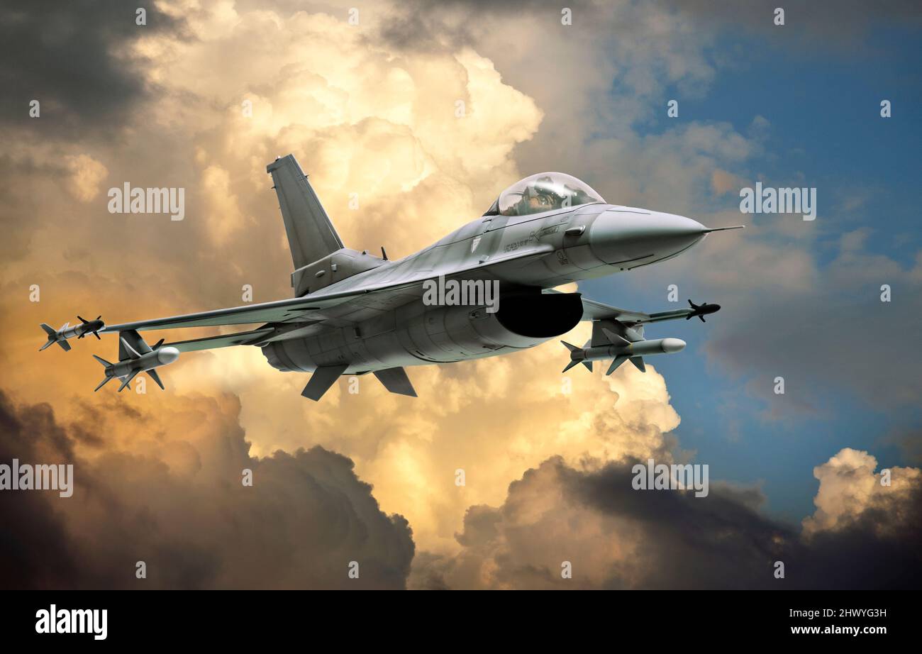 F-16 Fighting Falcon fighter jet (model) against dramatic clouds Stock Photo