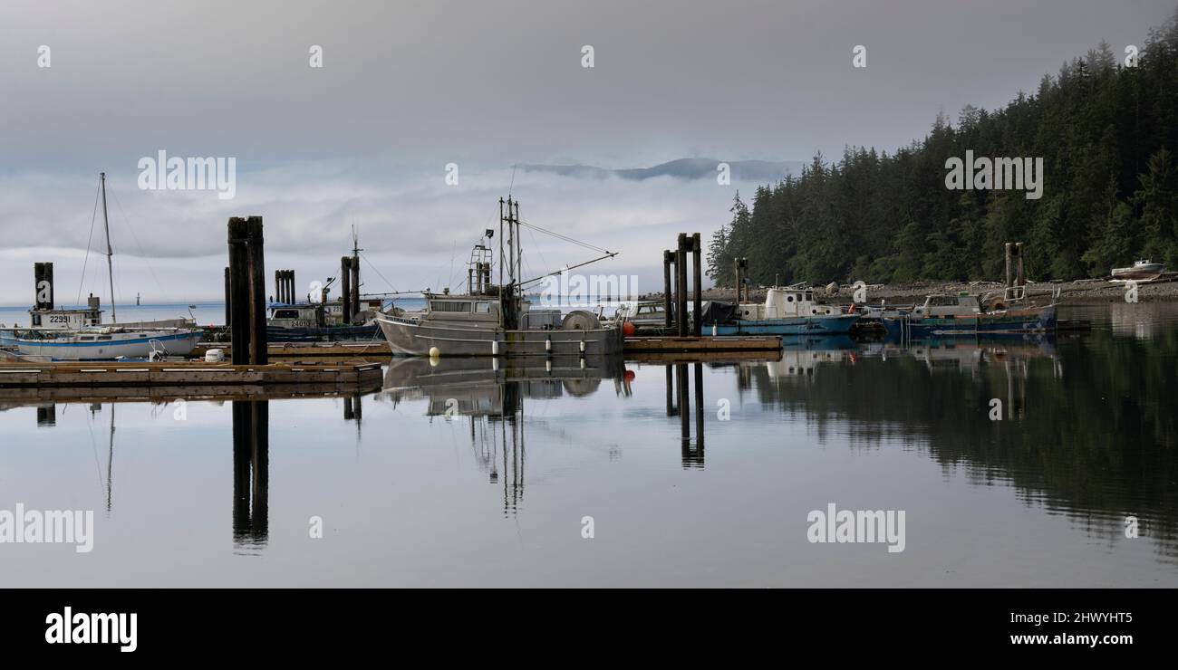 Boats docked and shoreline along Alert Bay, Cormorant Island, Johnstone Strait, Vancouver Island, British Columbia, Canada Stock Photo