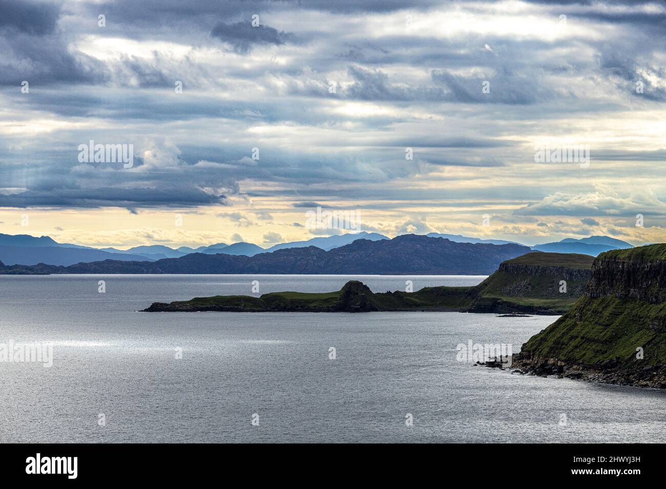 A view towards the Scottish mainland from the north east coast of the Isle of Skye, Highland, Scotland UK. The Isle of Rona is in the foreground. Stock Photo