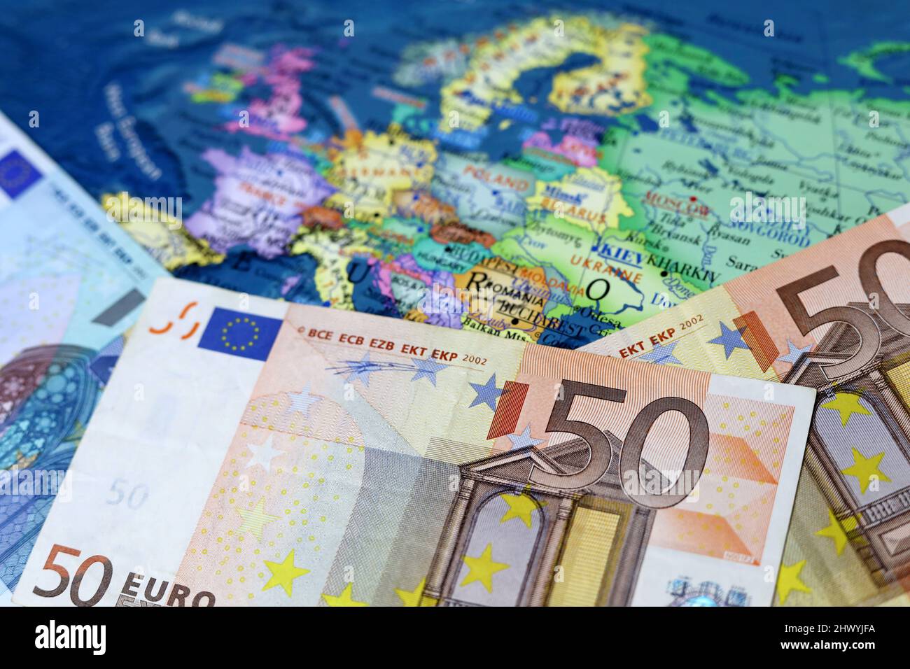 Euro banknotes on the Europe map. Concept of Eurozone, European economy, EU financial support of Ukraine Stock Photo