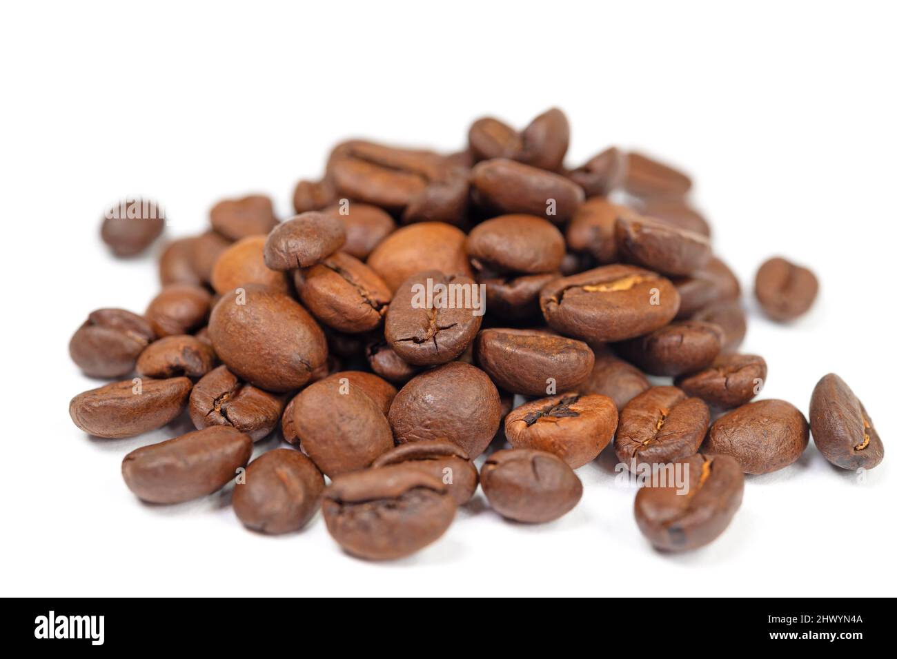 Roasted coffee beans against white background Stock Photo