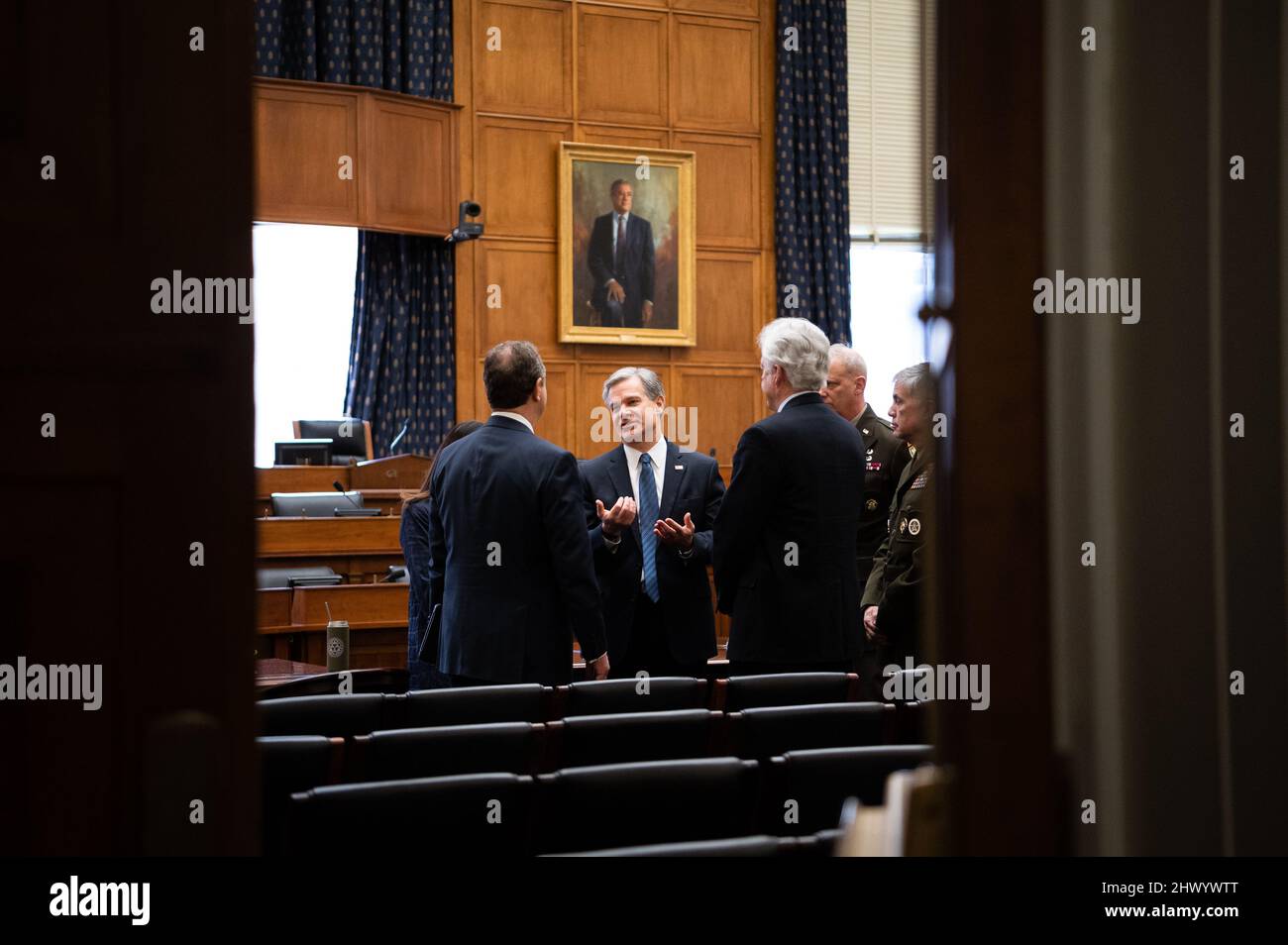 Federal Bureau of Investigation Director Christopher Wray, center, speaks with Director of National Intelligence Avril Haines, Representative Adam Schiff (D-CA), Central Intelligence Agency Director William Burns, Defense Intelligence Agency Director Lieutenant General Scott Berrier, and National Security Agency Director General Paul Nakasone before a House Permanent Select Committee on Intelligence hearing on Worldwide Threats, at the U.S. Capitol in Washington, DC, on Tuesday, March 8, 2022. This week Congress will urgently push to pass a government funding bill, with billions of dollars i Stock Photo