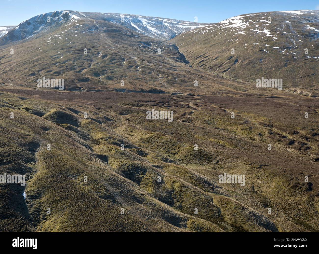 Aerial view of Talla and Gameshope habitat restoration project being undertaken by Borders Forest Trust. Single tree planter for scale bottom RHS. Stock Photo