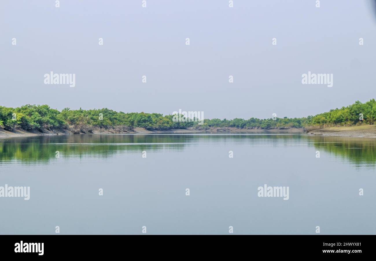 Amazing landscape of lake with clear green water and Perfect sky. Panoramic view of the beautiful mountain landscape. Stock Photo