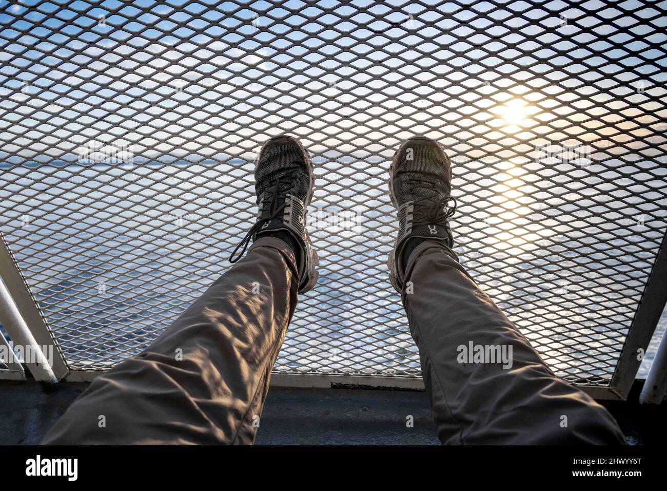 Running Shoes pressed against wire railing on a BC Ferry traveling from