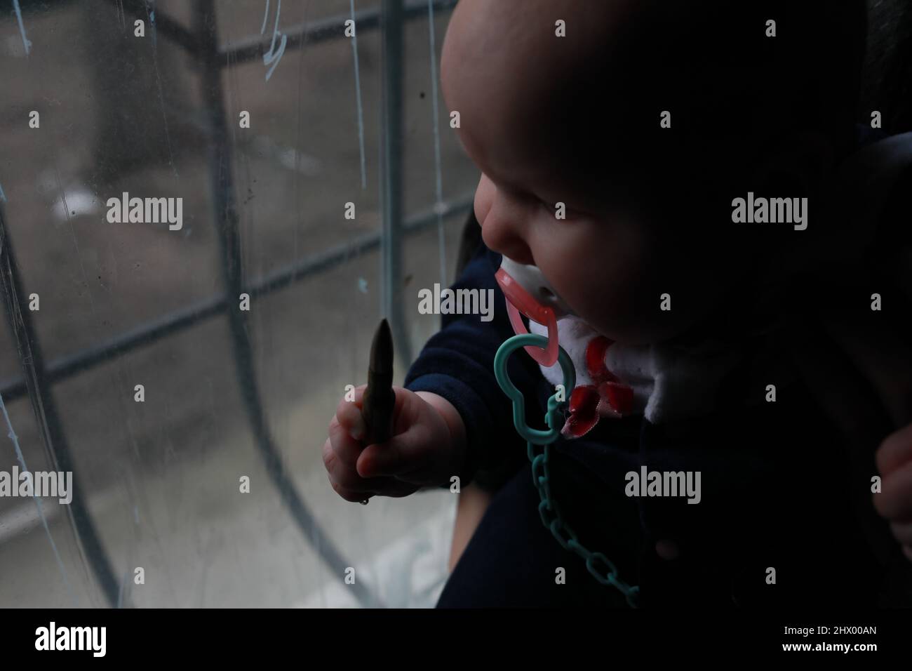 Russia's war against Ukraine. Children hiding in a shelter Stock Photo