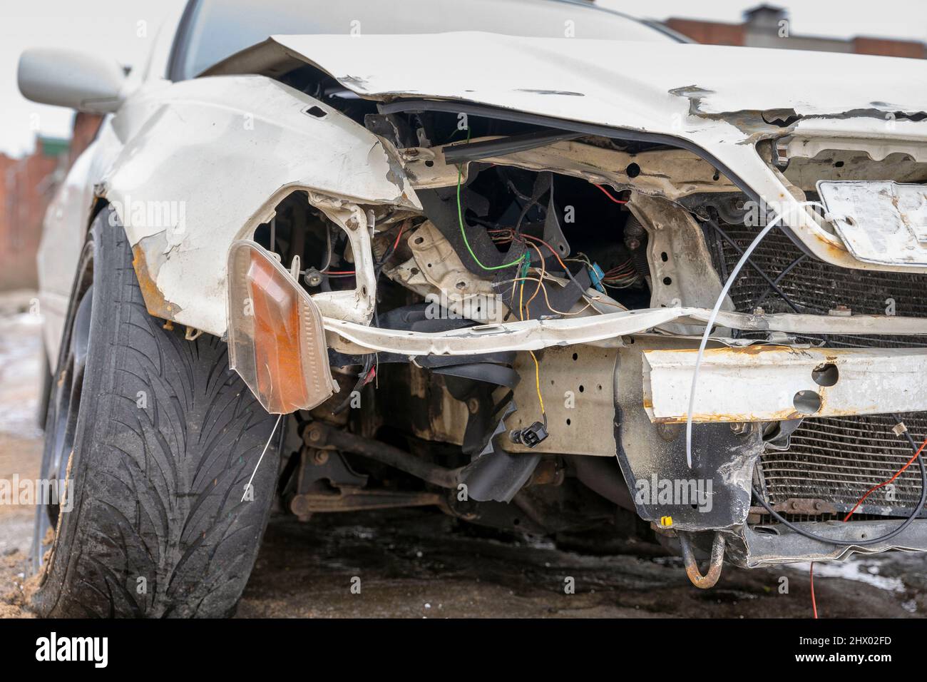 Broken Car after a Crash. Damaged Wing and Headlamp of a Car