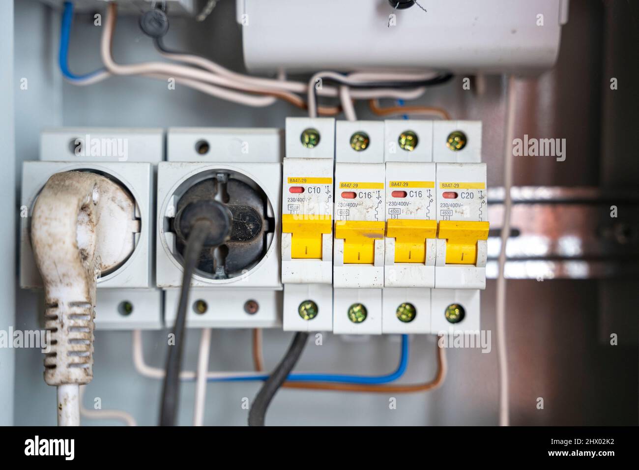 electrical panel with sockets and circuit breakers with wires. Stock Photo
