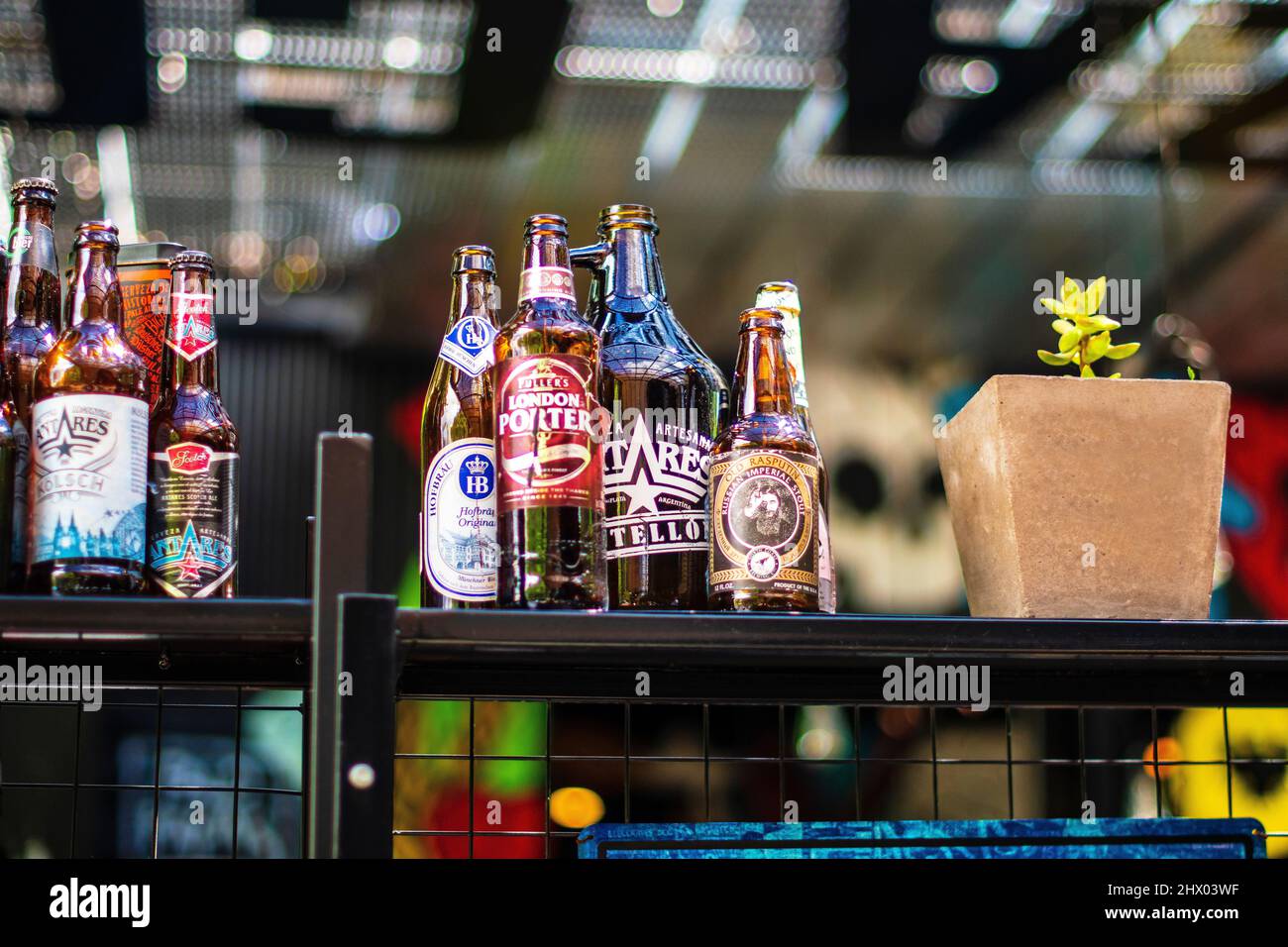 Craft beer bottles on a bar counter Stock Photo