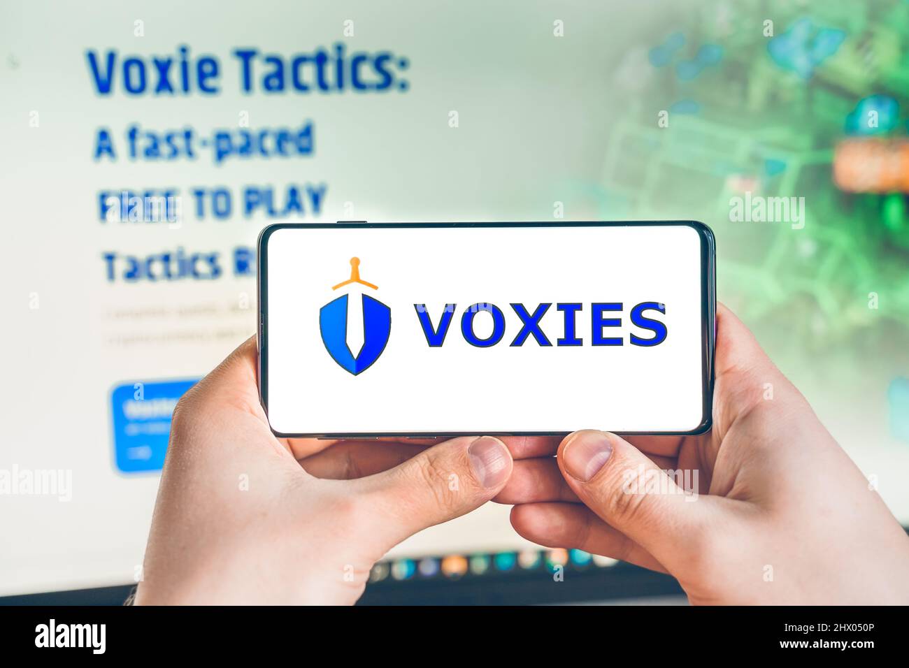 Russia Moscow 25.12.2021 Logo of Voxies, VOXEL. Blockchain nft ethereum  cryptocurrency strategy game. Man playing in laptop,mobile phone. Crypto  coin Stock Photo - Alamy