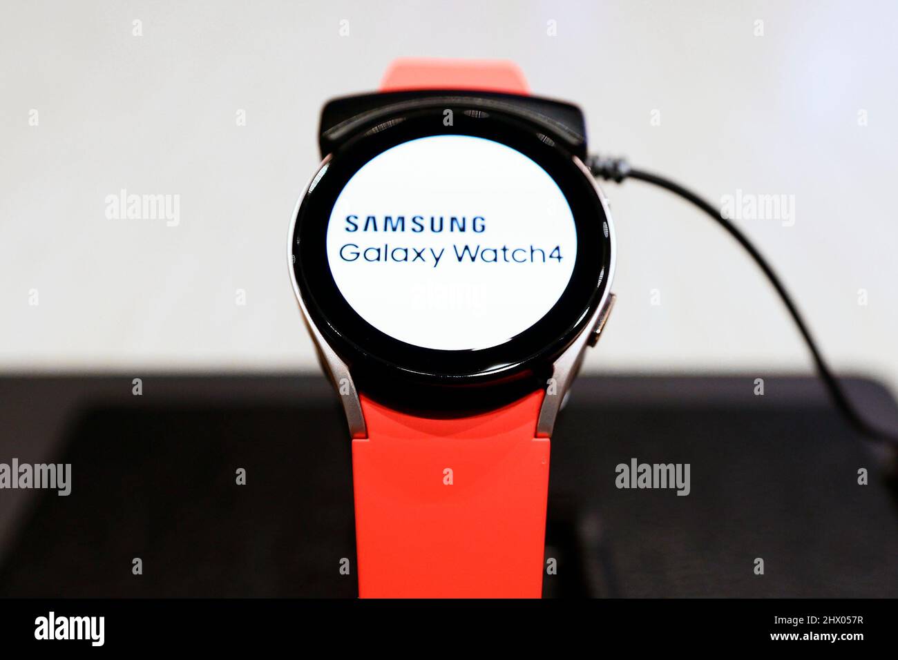 2/28/2022) A red Samsung Galaxy Watch4, the latest wearable smartwatch  presented by the South Korean brand, being exhibited at Mobile World  Congress (MWC) the biggest trade show of the sector focused on