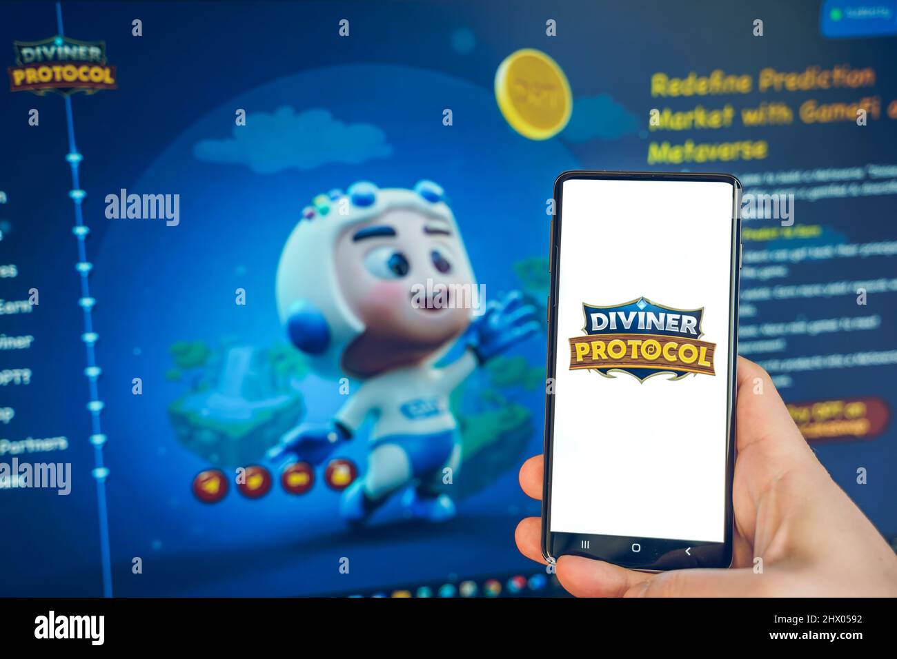 Russia Moscow 25.12.2021 Logo of metaverse Diviner Protocol, DPT. Blockchain  nft ethereum cryptocurrency strategy game.Man playing in mobile phone.Cry  Stock Photo - Alamy