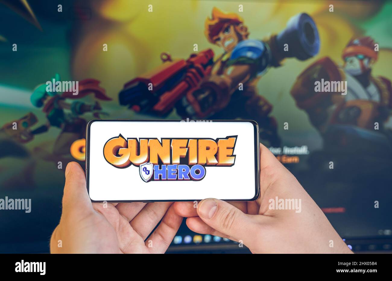 Russia Moscow 25.12.2021 Logo of metaverse Gunfire Hero. Blockchain nft ethereum  cryptocurrency strategy game.Man playing in mobile phone. Crypto coin Stock  Photo - Alamy