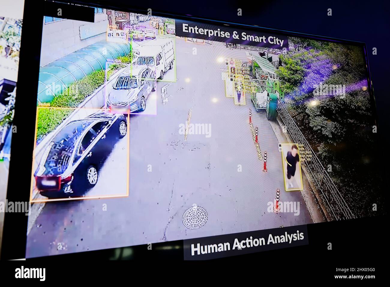 SK telecom demonstrating several uses of AI Camera person detection and  face recognition to prevent accidents, collect data and enhance security.  In the screen we can see how the software recognises different