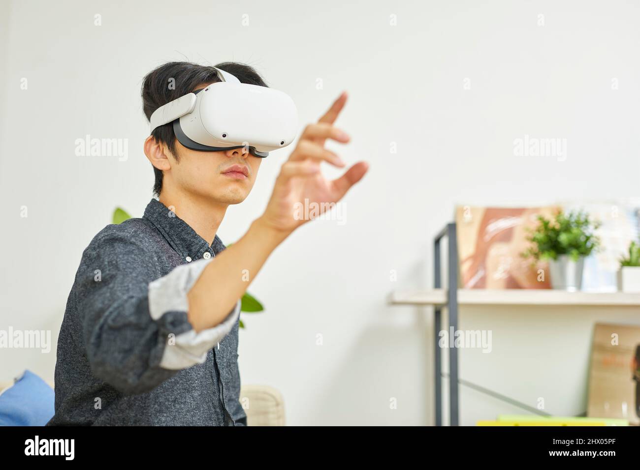 Japanese Man Wearing VR Goggles Stock Photo Alamy