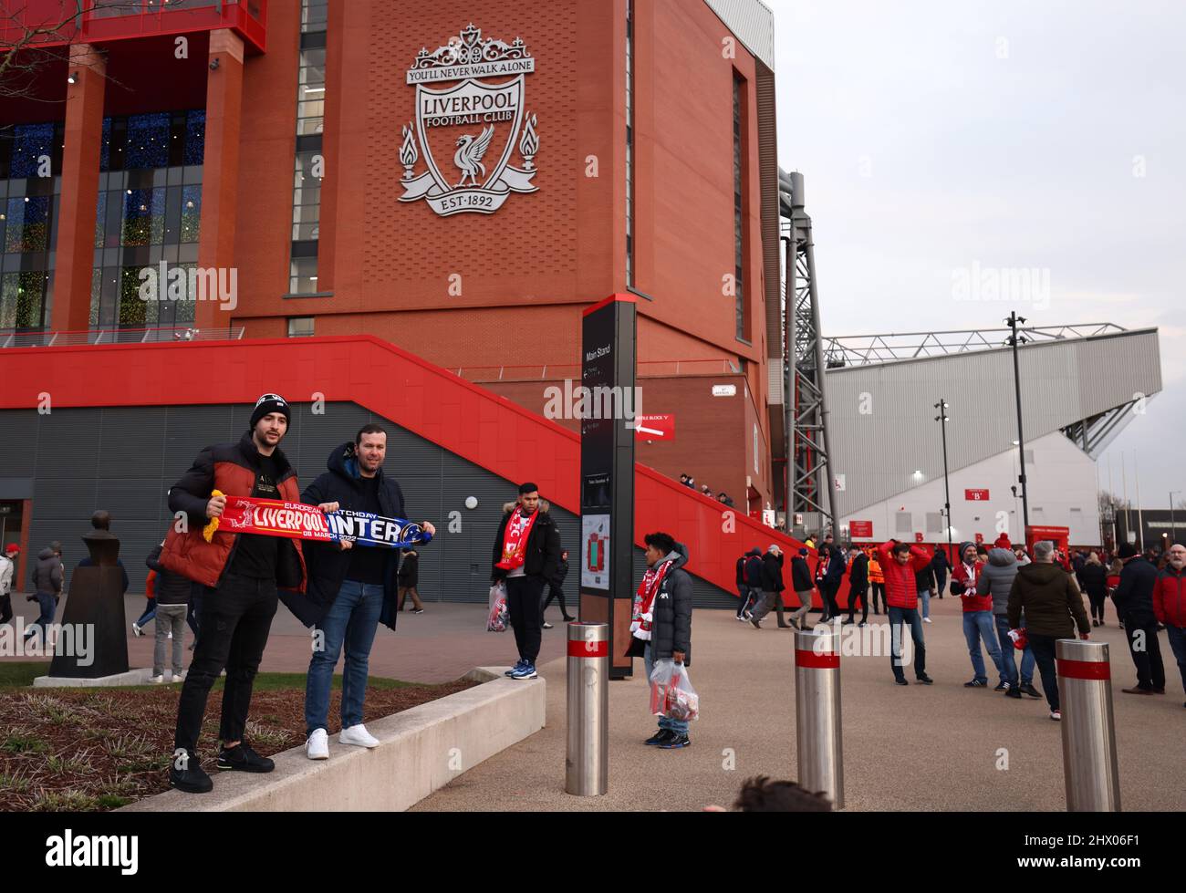 Liverpool, England, 8th March 2022.   Fans pose for pictures outside the stadium during the UEFA Champions League match at Anfield, Liverpool. Picture credit should read: Darren Staples / Sportimage Stock Photo