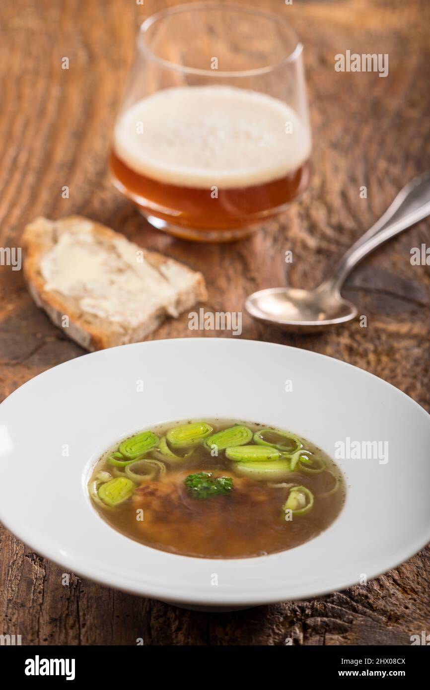 austrian cheese dumpling soup on wood Stock Photo