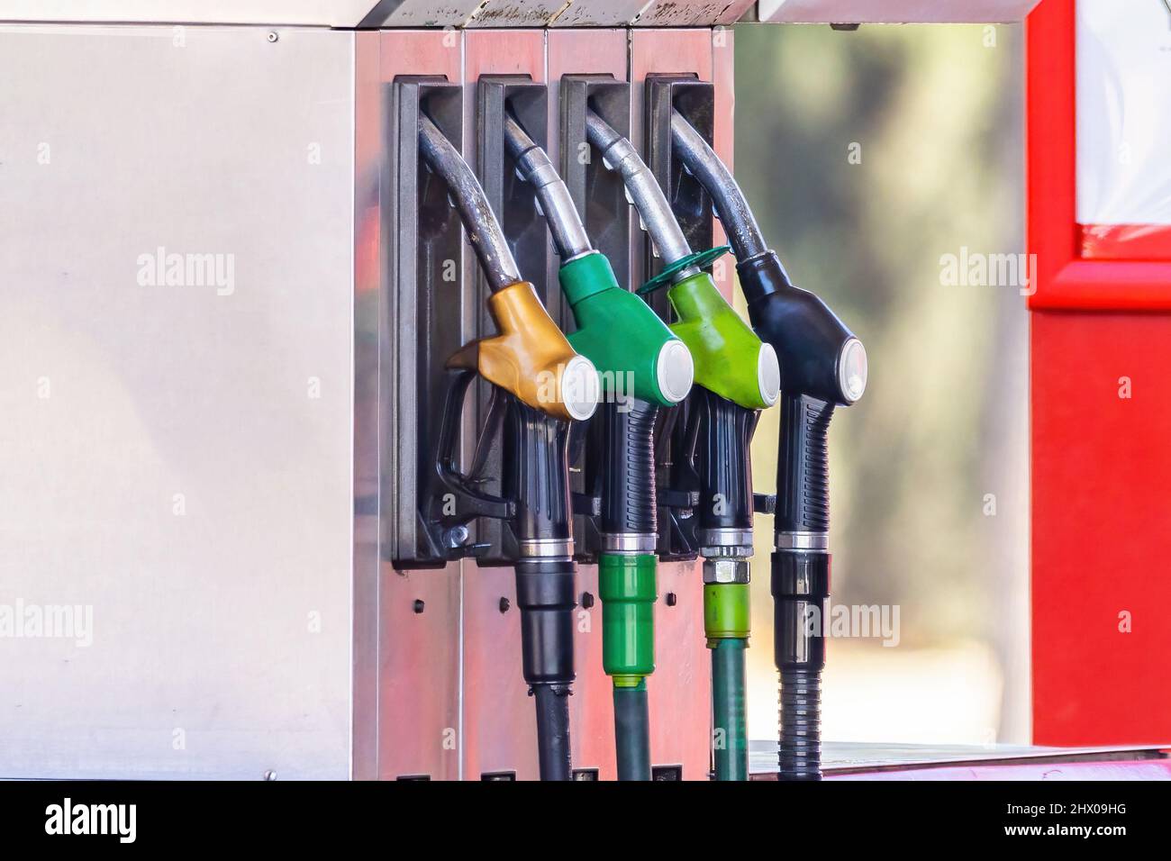 Pump nozzles of a petrol pump in service station Stock Photo