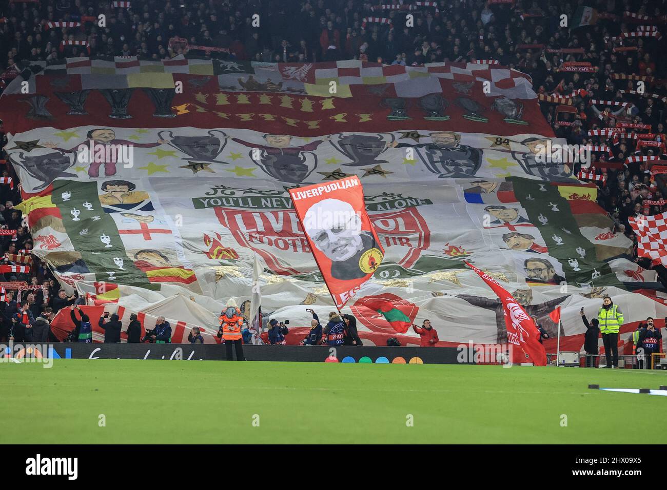 The Kop end at Anfield as Liverpool fans wave their flags Stock Photo