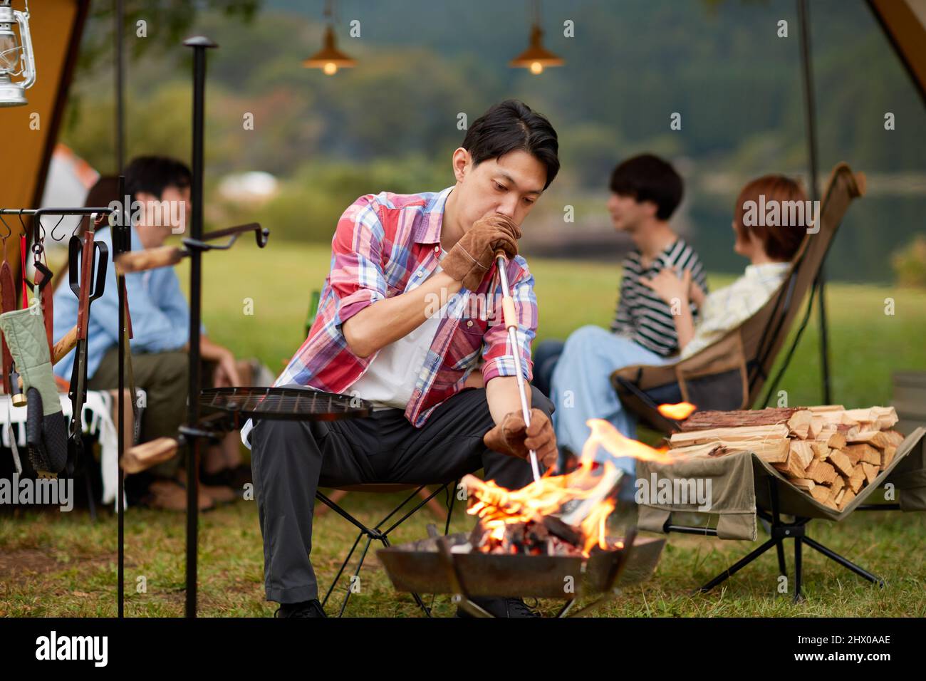 Japanese Men Making A Fire Stock Photo - Alamy