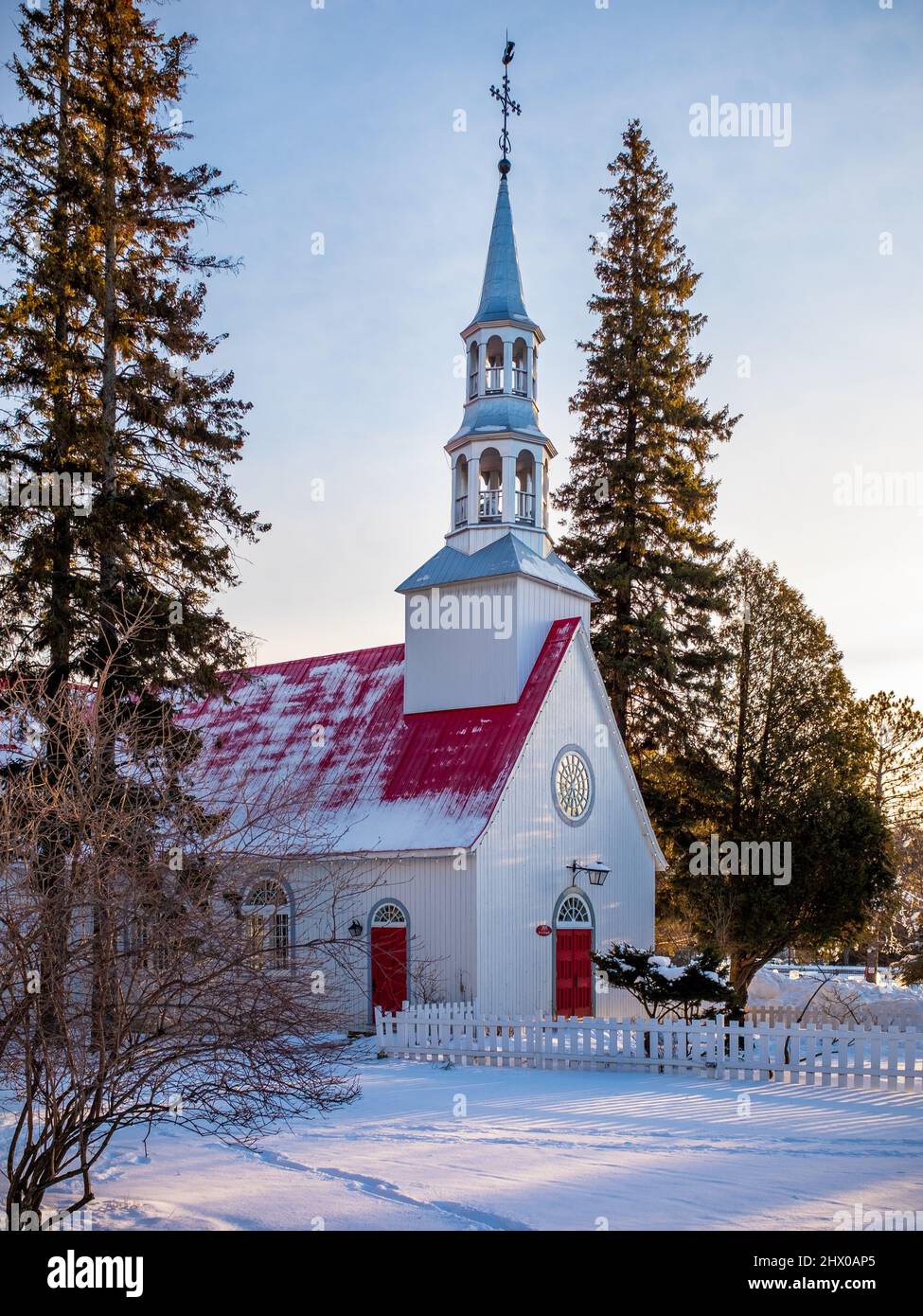 St. Bernard chapel at Mont-Tremblant ski resort, Quebec, Canada at the end of a sunny winter day with snow on the ground Stock Photo