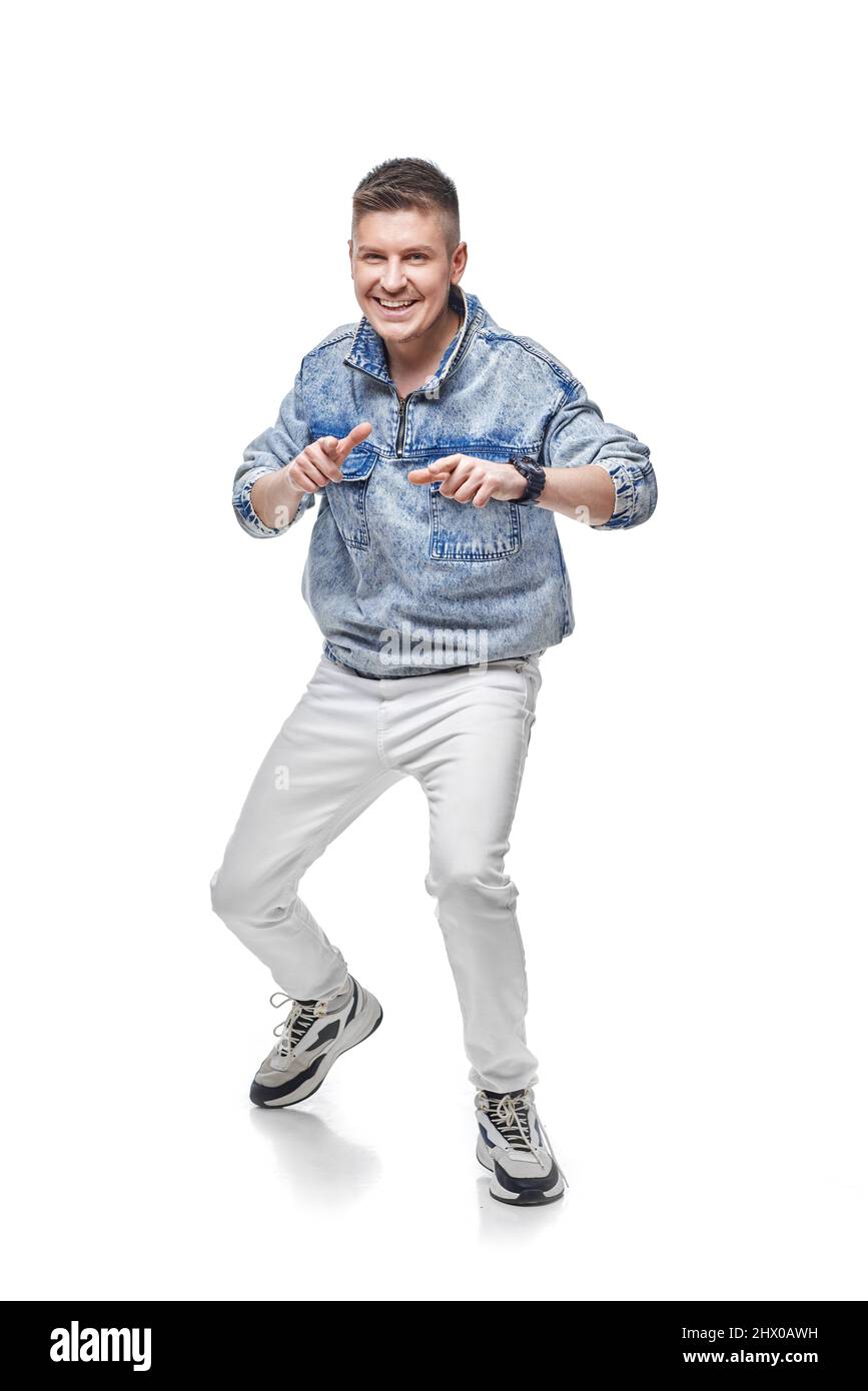 handsome young man in denim jacket with fist up Stock Photo