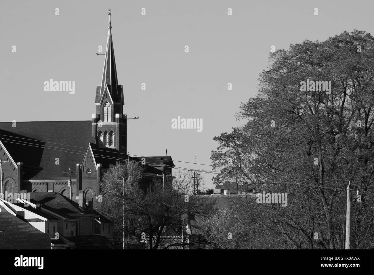 Monochrome skyline landscape with church steeple Stock Photo