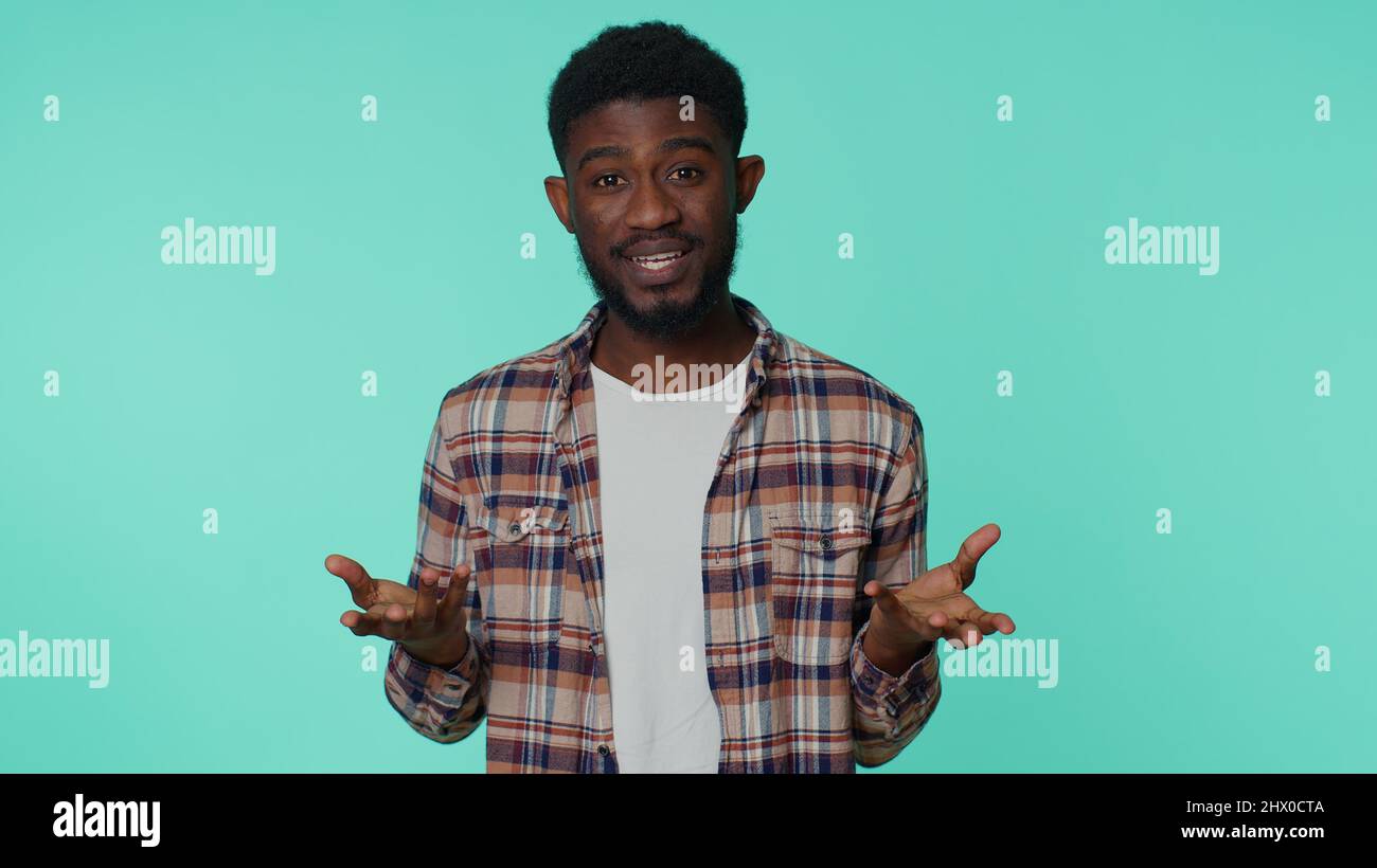 Man raising hands in indignant expression asking why what reason of