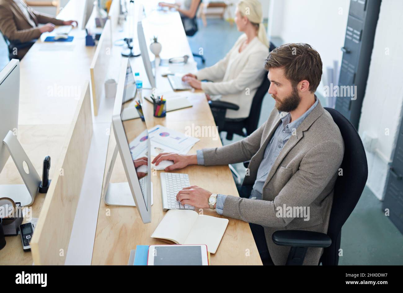 Totally focused on his work. Shot of a designer at work in an office. Stock Photo