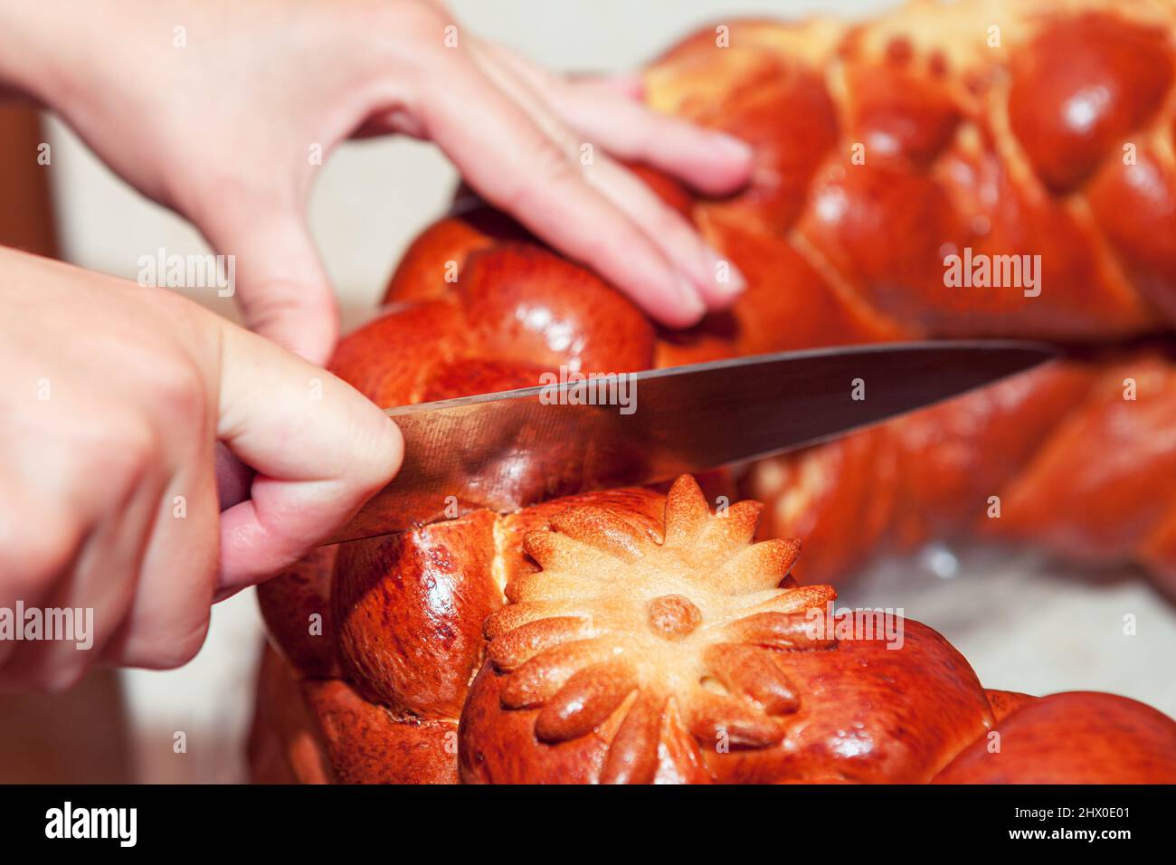 Slicing bread . Cutting with Knife A Loaf Of Bread Stock Photo Alamy