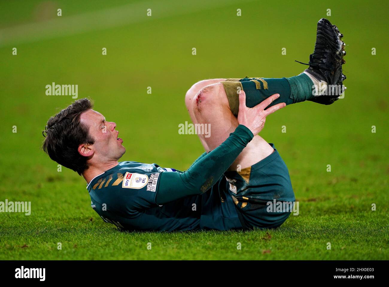 Middlesbrough's Jonny Howson goes down injured during the Sky Bet Championship match at Bramall Lane, Sheffield. Picture date: Tuesday March 8, 2022. Stock Photo