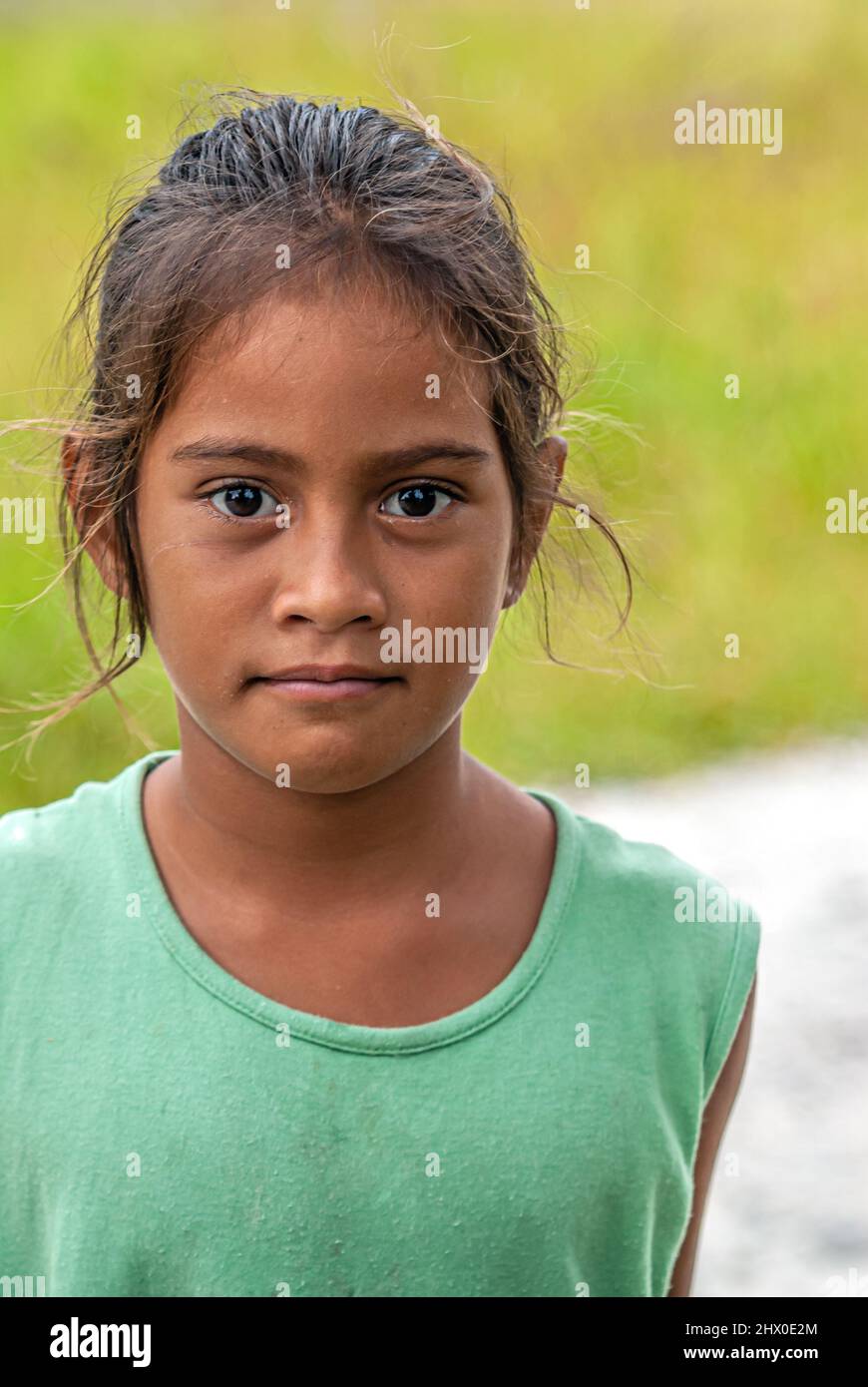 Portrait of a cute Polynesian girl at the Tuamotu Islands, French Polynesia Stock Photo